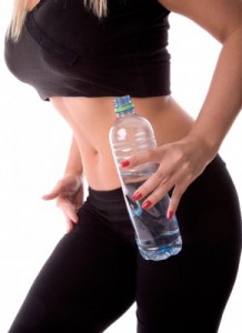 Very fit woman with water bottle.